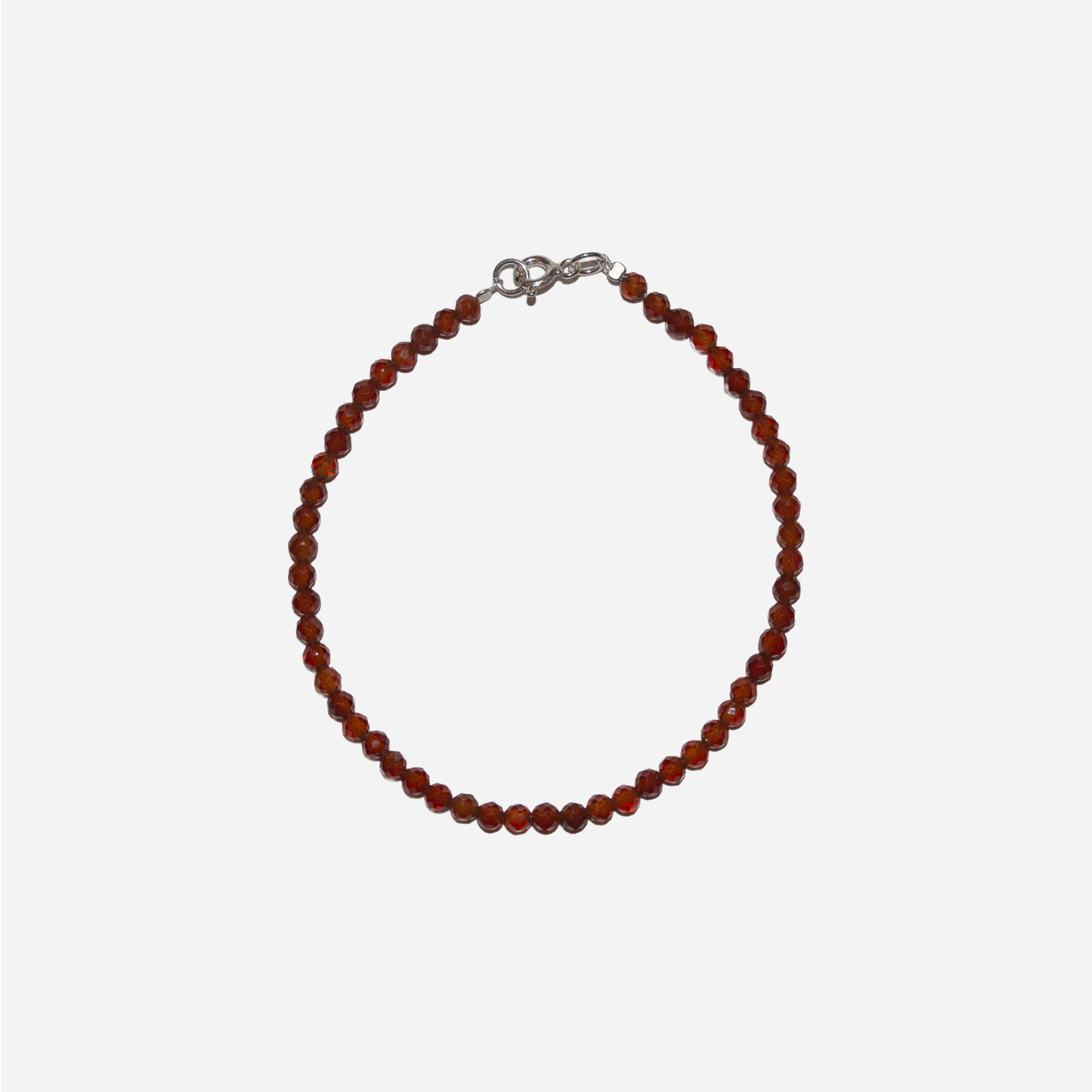 bransoletka z fasetowanym, pomarańczowym granatem