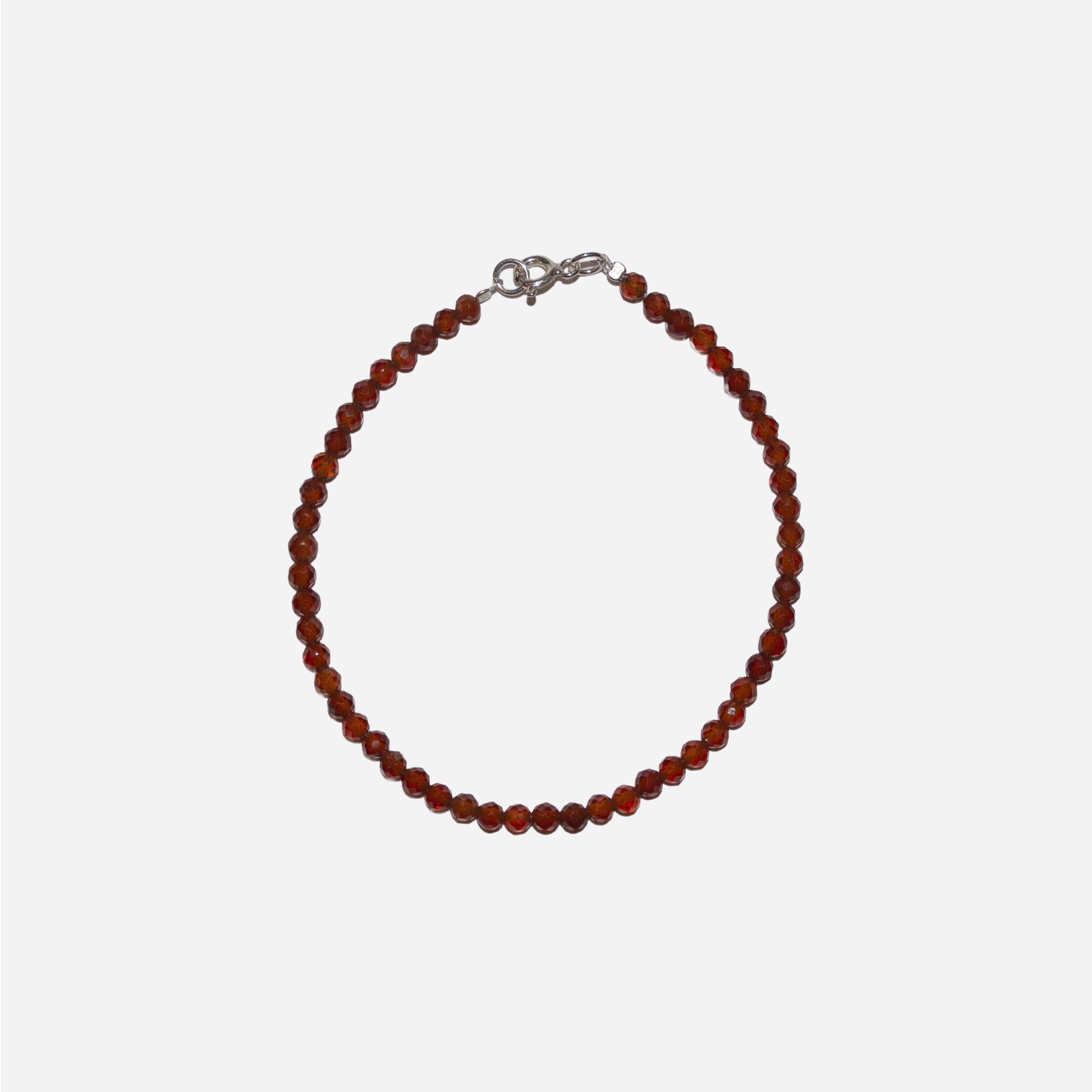 bransoletka z fasetowanym, pomarańczowym granatem