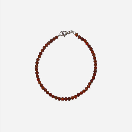 bransoletka z fasetowanym, pomarańczowym granatem